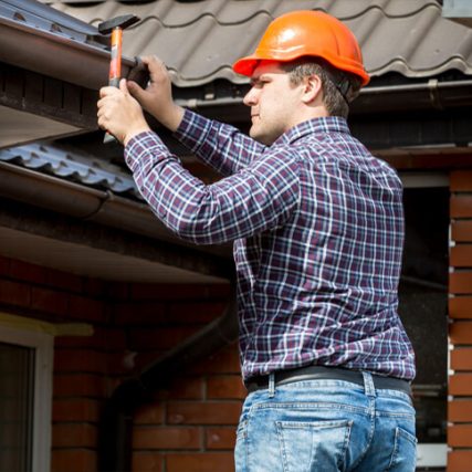Roofing Specialist working in day time at 1 pm with proper safety in melbourne city