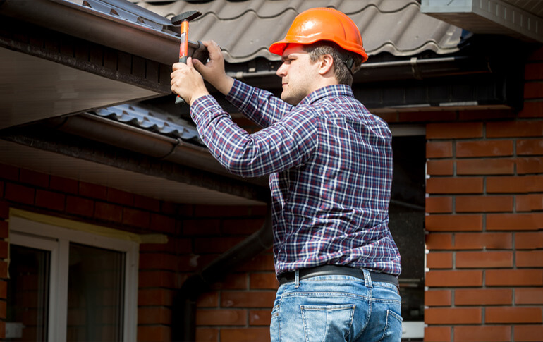 Roofing Specialist working in day time at 1 pm with proper safety in melbourne city